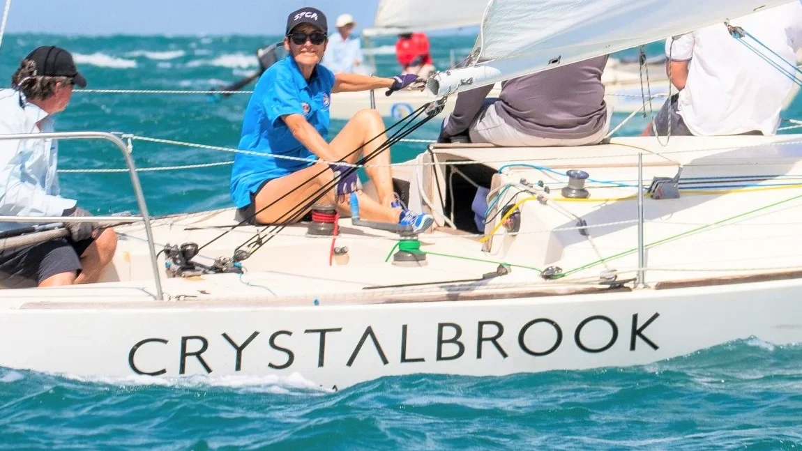 lady racing with a monohull